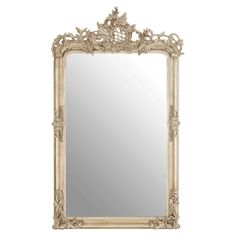 an ornate white framed mirror on a wall