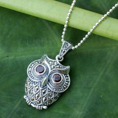 An owl with bright garnet eyes comes to life in sterling silver. Set with faceted marcasite the curious little bird adorns a necklace by Narinee in Thailand. .925 Sterling silver Marcasite Jewelry, Single Stone Ring, Sterling Silver Heart Necklace, Gems Bracelet, Owl Necklace, Owl Jewelry, Garnet Pendant, Owl Pendant, Silver Heart Necklace