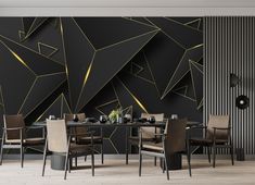 a modern dining room with black and gold wallpaper