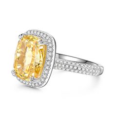 Resplendently styled with a yellow center stone, the engagement ring is designed to shine from every angle. The glittering centerpiece is complete with a halo of small round stones and shimmering stone-set shoulders, which enhance the brilliance of this chic design. Infused with elegance and effulgence, it enriches your lady's beautiful look and charming personality. Make it a perfect engagement ring and honor your flaming love.Carat Weight: 9.715 ctStone Size: 10*12 mmStone Type: Jeulia® StoneN Cushion Cut Yellow Ring With Center Stone, Elegant Diamond Topaz Ring With Pave Setting, Yellow Cushion Cut Ring With Center Stone, Fine Jewelry Yellow Diamond Ring With Halo Design, Formal Diamond Pave Set Topaz Ring, Yellow Diamond Ring With Halo, Formal Topaz Ring With Diamond Pave Setting, Formal Topaz Ring With Pave Diamond Setting, Yellow Cushion Cut Diamond Ring With Center Stone