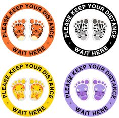 four circular stickers with footprints and words on them that say please, keep your distance wait here