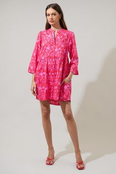 Look good in every occasion wearing the Cecy Floral Brie Button Down Dress! A pink and red floral print enchant long sleeves followed by a button-down placket in the front. It has a flowy fit making it comfortable to move around. Keep it simple with sandals or add heels for a more outgoing style. - Long Sleeves- Pockets- Lined- Button down- Color: Red PinkSize + Fit - Model is 5'11" and wearing size XS- Measurements taken from size S - Chest: 19"- Length: 33 3/4" Fabric Self: 100% Cotton, Lining Pink Floral Print Dress With Relaxed Fit, Spring Pink Split Neck Dress, Pink Fall Daywear Dress, Pink Daywear Dress For Fall, Printed Long Sleeve Relaxed Fit Dress, Spring Pink Dress With Relaxed Fit, Red Relaxed Fit Long Sleeve Dress, Pink Printed Daywear Dresses, Long Sleeve Floral Print Relaxed Fit Dress