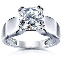 a white gold ring with a diamond in the center