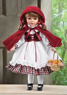 a doll dressed in red and white holding a basket