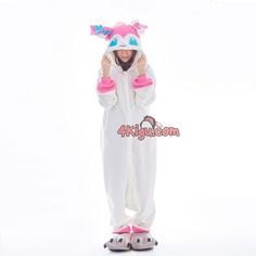 a person in a white bunny costume with pink and blue ears standing on one leg