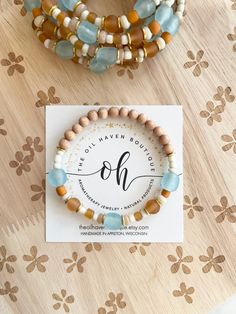 Bohemian Coastal Vibes! Seaglass, glass beads, Java Beads, + 18k gold! Gorgeous diffuser Bracelet with beautiful ethnic beads, seashells + gemstones! Simply add 1-2 drops of your favorite essential oil to the Raw Wood Beads & enjoy the therapeutic benefits of your oil all day long! I use a very strong Latex Free cord that will uphold up under every day use of putting your bracelet on and off. Unnecessary stretching of cord will weaken bracelet. * Size to fit almost 7 - 7 1/2 inches Additional si Beach Glass Jewelry Hand-strung, Bohemian Recycled Glass Bracelets As Gift, Spiritual Recycled Glass Beaded Bracelets As Gifts, Spiritual Beaded Bracelets With Recycled Glass As Gift, Recycled Glass Beaded Bracelets As Gift, Adjustable Recycled Glass Bracelets As Gift, Recycled Glass Beaded Bracelet Gift, Bohemian Recycled Glass Bracelet, Recycled Glass Large Beads Bracelet Gift