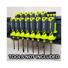 there are many screwdrivers on the wall with words that read tools not included