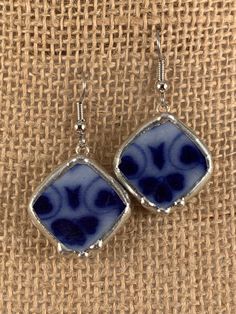 These Antique Chinawear earrings were created from a chipped flow blue platter that was produced in England.  The earrings measure approximately 7/8" square on point.  A pretty floral pattern is depicted.  The ear wires are hypoallergenic surgical steel.  Sterling wires are available on request. Normally I find the unique antique china items that I utilize for jewelry at antique shows and shops. Each design is cut on a porcelain/tile saw, shaped on a grinder, and finished with a silver solder be Blue Rectangular Earrings With Ear Wire, Blue Rectangular Earrings, Nickel Free Blue Rectangular Jewelry, Vintage Blue Hypoallergenic Earrings, Blue Hypoallergenic Vintage Earrings, Blue Square Earrings For Gift, Tile Saw, Antique Show, Broken China