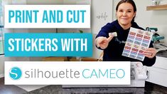 a woman holding up a sticker with the words print and cut sticks with silhouette cameo