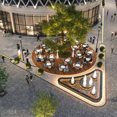 an aerial view of a courtyard with tables and chairs