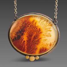 A very special dendritic agate evokes a mysterious and lovely scene in nature. The stone is wrapped in 22k gold, and accented with a 22k gold trio. This magical pendant is backed in sterling silver, and suspended from an oxidized sterling silver chain. Pendant measures approximately 1 inch x 1 inch. Matte finish. This piece is in stock and ready to ship. Magical Pendant, Silver Chain Pendant, Dendritic Agate, Agate Necklace, Chain Pendant, Oxidized Sterling Silver, 22k Gold, Sterling Silver Chain, In Nature