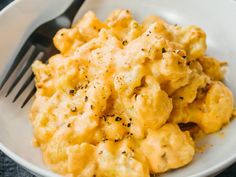 a white bowl filled with macaroni and cheese