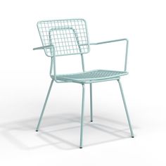 a green metal chair sitting on top of a white floor