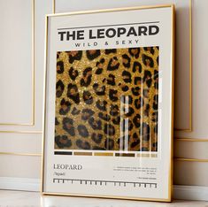 a leopard print with gold glitters on it and a ruler in the foreground