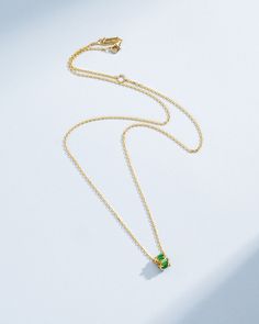 Crafted in 18-karat gold, this necklace features a mini rondelle pendant set with emerald baguettes. This simple design makes a great everyday addition to any wardrobe. Details 18k yellow gold 0.70 carats of emerald baguettes Measures 18" inches in length, adjustable at 16" inches Lobster clasp fastening 6mm width Ref: BAP859E Minimalist Yellow Gold Emerald Necklace, Jewelry Tray, Pendant Set, Ring Bracelet, Simple Design, Ring Shopping, Diamond Rings, Semiprecious Stones, Precious Stones