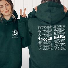 Stay cozy on the sidelines with our Custom Soccer Mama Sweatshirt! This stylish Sports Mom Sweater is perfect for game days and beyond. Personalize it with your player's name to create a unique Custom Name Soccer Sweater that celebrates your Soccer Mom Life. It's a thoughtful Gift Shirt for Sports Moms who love supporting their athletes. Whether it's a chilly game day or just everyday wear, this Game Day Hoodie is a must-have for every proud soccer mom! Hi all, welcome to the Comfy Tee Design, It's so nice to see you here. If you are looking for soft, comfy and high quality sweatshirts, I have good news for you: You're at the right place!  Sweatshirts are unisex sizing. It's proper, comfortable and flattering for men and women, but may run  large for the ladies. Please see the size chart t Sporty Long Sleeve Hoodie For Fan Merchandise, Sports Season Hoodie Sweatshirt, Sports Fan Hoodie Top, Sports Fan Apparel Top With Drawstring Hood, Sports Fan Apparel Tops With Drawstring Hood, Sports Season Fleece Hoodie, Green Sports Activewear With Drawstring Hood, Sporty Sweatshirt With Drawstring Hood For Sports Season, Green Sports Activewear Hoodie