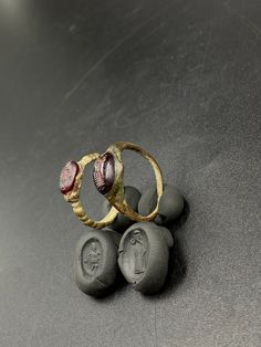 The Lot of Total 2 Beautiful Bronze Ring With Unique Intaglio Seal Stamp Engraved (Carved)On Garnet Stone A Human Figure Probably From Ancient Achaemenid Empire Civilizations. Originated From Central Asia. The Ring Intaglio Is Imprinted On Wet Clay For Better View In The Pictures . Rare Ancient Bronze Jewelry Ring . Best Item For Collections and Study . Fast and Free Shipping World Wide. Bronze Clay Jewelry, Ancient Style Carved Rings Gift, Ancient Ceremonial Round Rings, Gold Byzantine Carved Jewelry, Byzantine Style Carved Gold Jewelry, Ancient Ceremonial Jewelry, Traditional Carved Yellow Gold Rings, Ancient Ceremonial Hallmarked Jewelry, Formal Byzantine Engraved Rings