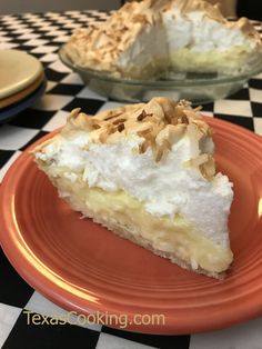 a slice of pie on an orange plate with a black and white checkered tablecloth