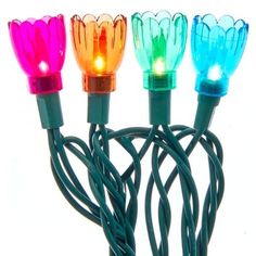 multi - colored christmas lights are arranged in a row on a white background with cords