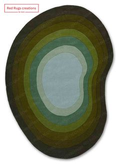 an oval rug with green and brown circles on the top, in various colors to match