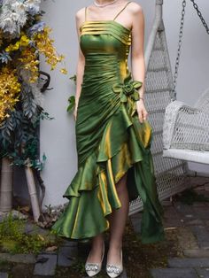 Step into timeless elegance with our Grass Green Vintage Floral Dress. This exquisite prom gown features an asymmetrical hem that adds a touch of modern flair to its classic silhouette. The delicate spaghetti straps gracefully highlight your shoulders, making it perfect for a memorable adult ceremony or any special occasion. The lush grass green fabric evokes a sense of vintage charm while ensuring you stand out in any crowd.  Garment Size   	 		 			Size 			XS 			S 			M 			L 			XL 		 		 			Bust Green Cowgirl Dress, Prom Dress Inspiration Elegant, Midsummer Prom Dress, Hawaiian Homecoming Dress, Hoco Unique Dresses, Luxury Brand Dresses, Hippy Prom Dress, 80s Inspired Prom Dress, Green And Pink Prom Dress