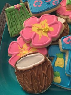 some decorated cookies on a blue plate