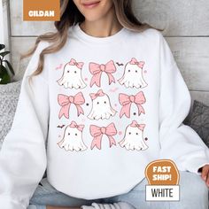 🎀👻 Kawaii Ghost Coquette Crewneck Sweatshirt👻🎀 Get ready for the spooky season in THE most adorable way possible with this Kawaii ghostie take on the coquette trend. This sweater will keep you warm, but will also make sure you stay looking cute while you do it! There are 6 colour options and 7 sizes to choose from and would make an awesome gift for the Halloween lovers in your life. ✨Check out the other awesome gifts (for a friend, or yourself!) in my shop: https://www.etsy.com/ca/shop/Fable Casual Halloween Anime Print Sweatshirt, Casual Anime Print Sweatshirt For Halloween, Fall Kawaii Style Sweatshirt With Cartoon Print, Kawaii Cartoon Print Sweatshirt For Fall, Playful White Sweatshirt With Character Print, White Kawaii Sweatshirt For Fall, Playful White Sweatshirt For Fall, Kawaii Letter Print Sweatshirt For Fall, Cute White Tops For Halloween