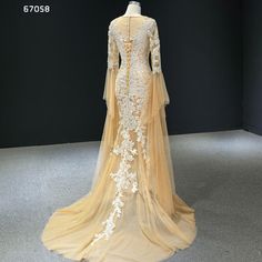 a wedding dress on display in a museum