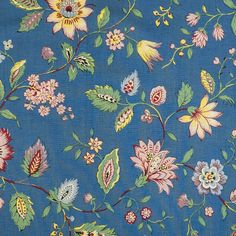 a blue background with colorful flowers and leaves on the bottom half of it is shown