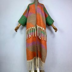 This super soft and warm wool cardigan kimono is perfect for the cold weather. Unlike other sweaters and wools, the wool used for this beauty is non itchy. Think of your favorite throw blanket, the comfort and warmth it gives but 10x stylish and wearable any where. This kimono is all that and more! One size fits S-4X Material: Wool One Size Fits Most Size Chart One Size Long Sweater For Fall, Long Multicolor Cardigan For Layering, Multicolor Long Cardigan For Layering, Wool Shawl Outerwear For Winter, Bohemian Shawl For Fall Layering, One Size Winter Acrylic Sweater Coat, One Size Acrylic Sweater Coat For Winter, Cozy Long Acrylic Outerwear, One Size Long Cardigan For Winter