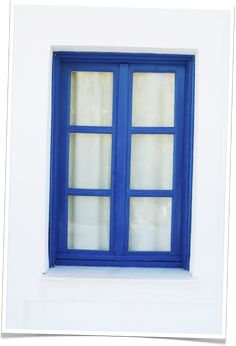 an image of a blue window with white trim