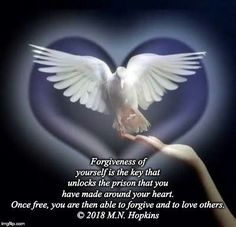 a person holding a dove in their hand with the words, forgiveness of yourself is the key that unlocks the prison that you have made around your heart