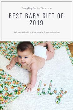 a baby laying on top of a blanket with the words best baby gift of 2019