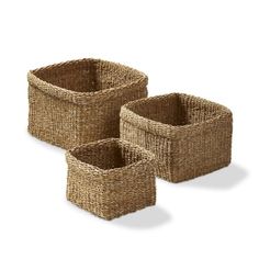 three woven baskets with handles are shown in this image, one is brown and the other is