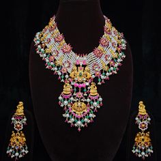 Elevate your elegance with our exquisite Kundan Silver Necklace with Earrings, a harmonious blend of traditional allure and contemporary sophistication. Crafted with precision, the set features intricately detailed Kundan stones set in sterling silver, creating a mesmerizing symphony of craftsmanship. The necklace gracefully drapes along the neckline, accentuating its wearer's grace, while the matching earrings add a touch of regal charm. Each piece reflects timeless artistry, making it a perfect choice for special occasions, weddings, or cultural celebrations. Embrace the allure of Indian heritage with this resplendent Kundan Silver Necklace with Earrings, a testament to enduring beauty. Returns not accepted, unless the product has a manufacturing defect or damaged during courier. Thank Y Multicolor 22k Gold Fusion Jewelry, 22k Gold Hallmarked Jewelry For Diwali, Hallmarked 22k Gold Jewelry For Festivals, Multicolor 22k Gold Jewelry For Festivals, Ceremonial 22k Gold Multicolor Jewelry, Bollywood Style Hallmarked Yellow Gold Jewelry, Handmade 22k Gold Jewelry For Diwali, Festive Gold Plated Kundan Necklace, Multicolor 22k Gold Temple Jewelry