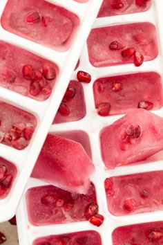 ice cubes filled with pomegranate sitting on top of each other