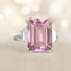 This gemstone and platinum ring features prong-set emerald cut 9.00-carat natural kunzite. The kunzite is very clean and has a beautiful vivid pink color. The center stone is flanked by a pair of trapezoid cut diamonds bezel-set on the shoulders, with a combined weight of 0.77 carats. The approximate measurements of the kunzite are 13.88mm x 10.26mm x 7.07mm. This ring can be resized to any finger size at no extra cost. If you have any questions about the Burbury ring, please feel free to contac Kunzite Ring, Estate Diamond Jewelry, Diamond Platinum Ring, Platinum Diamond Rings, Emerald Engagement Ring Cut, Platinum Ring, Perfect Engagement Ring, Bezel Diamond, Jewelry Cleaner