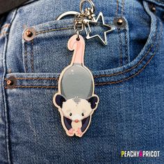 a keychain with an image of a mouse hanging from it's back pocket