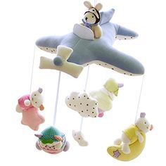 a baby crib mobile with stuffed animals hanging from it's sides and the words winging above them