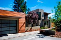 two garages are next to each other in front of a house