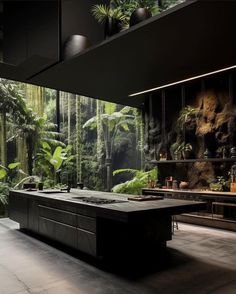 a large kitchen with an island in the middle and lots of greenery on the walls