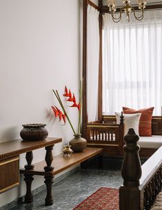 a living room filled with furniture next to a window