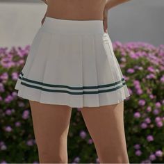 Gear Up For Victory On The Court Or Trail With This A-Line Tennis Skirt Featuring Comfortable Inner Shorts And On-Trend High Waist. Designed With Pleated Details Comfy Inner Short With Side Pocket Elastic Waistband Asymmetric Pleated Skirt High-Rise & Hits Above Upper Thigh White Short Tennis Skirt For Day Out, Casual White Tennis Skirt For Day Out, White High-waist Pleated Tennis Skirt, White High Waist Pleated Tennis Skirt, High Waist White Pleated Tennis Skirt, White Preppy Mini Tennis Skirt, Preppy White Mini Tennis Skirt, White Pleated Tennis Skirt In Preppy Style, White Preppy Skort