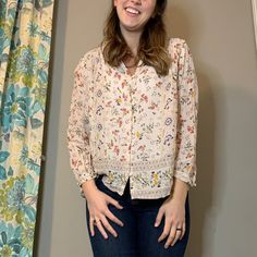 Cream Colored Peasant Top With Rich Gold, Red, Blue, And Green Floral Patterns. Cute Loop Buttons Dress Up The Front. Sheer Material So May Need A Cami Or Tank (Photograph 1 Features No Undershirt)! Perfect For Transitioning Into Spring. Purchased For $80 And Never Worn! Excellent Condition! Spring Floral Print Peasant Top, Spring Boho Print Rayon Blouse, Spring Peasant Blouse With Boho Print, Casual Rayon Peasant Top For Spring, Spring Rayon Blouse With Boho Print, Spring Bohemian Peasant Top In Rayon, Spring Bohemian Rayon Peasant Top, Bohemian Rayon Peasant Top For Spring, Casual Floral Print Peasant Top For Daywear