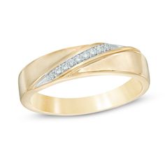 a yellow gold wedding ring with two diamonds