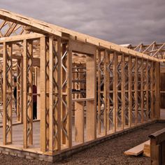 a house being built with wooden framing