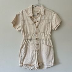 Brand New Never Worn Tts Beige Color Summer White Cotton Denim Jumpsuit, White Cotton Denim Jumpsuit For Summer, Casual Cream Jumpsuits And Rompers For Spring, White Casual Denim Jumpsuit For Work, White Cotton Overalls With Relaxed Fit, Trendy White Cotton Denim Jumpsuit, White Relaxed Fit Denim Jumpsuit For Summer, Trendy White Denim Jumpsuit With Pockets, Casual Beige Cotton Overalls