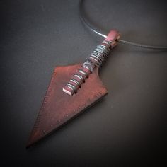 The handmade leather pendant offers a unique shape. Natural material builds symmetrical shapes of leave on a leather cord and unique architectural appearance. A great choice to express your personality and a contribution that definitely helps to building your own style. Leather Necklace Pendant, Handmade Leather Necklaces, Symmetrical Shapes, Brown Leather Necklace, Leather Necklaces, Leather Pendant, Necklaces Pendant, Handmade Pendant, Natural Material