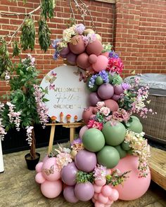 a cake made out of balloons and flowers