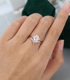 a woman's hand with a diamond ring on it